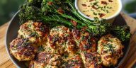 Garlic-Parmesan Chicken Bites with Sun-Dried Tomato Cajun Alfredo and Charred Broccolini