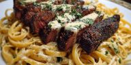 Cajun Garlic Butter Steak over Creamy Parmesan Linguine