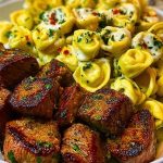 Garlic Butter Steak Bites with Creamy Parmesan Tortellini and Garlic Sauce